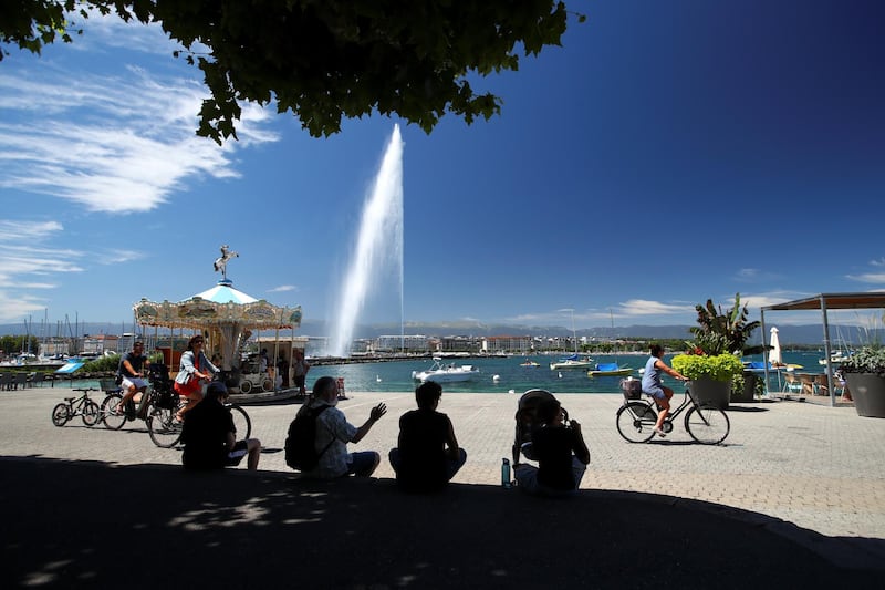 No 9 SWITZERLAND: People rest in front of the Jet d'Eau water fountain in Geneva. Switzerland remains one of the safest and wealthiest places in the world. Denis Balibouse / Reuters