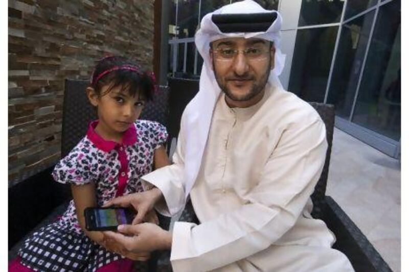 Amer Al Hajj, an IT student at the University of Dubai, says the app has helped his daughter Fatima's English pronunciation. Jaime Puebla / The National