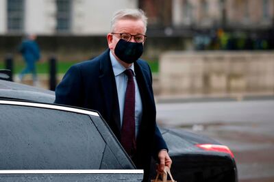 Britain's Chancellor of the Duchy of Lancaster Michael Gove arrives at the Whitehall entrance of the Cabinet Office in central London on December 21, 2020. The British prime minister was to chair a crisis meeting on December 21 as a growing number of countries blocked flights from Britain over a new highly infectious coronavirus strain the UK said was "out of control".  / AFP / Tolga Akmen
