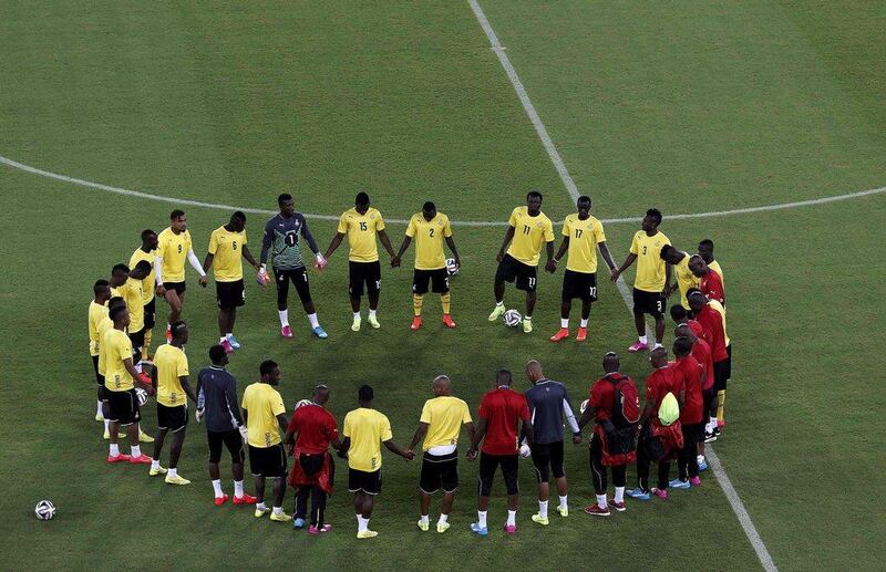 Ghana circle around for a team meeting during a training session on Sunday in Natal ahead of their 2014 World Cup Group G opener against USA on Monday. Carlos Barria / Reuters / June 15, 2014