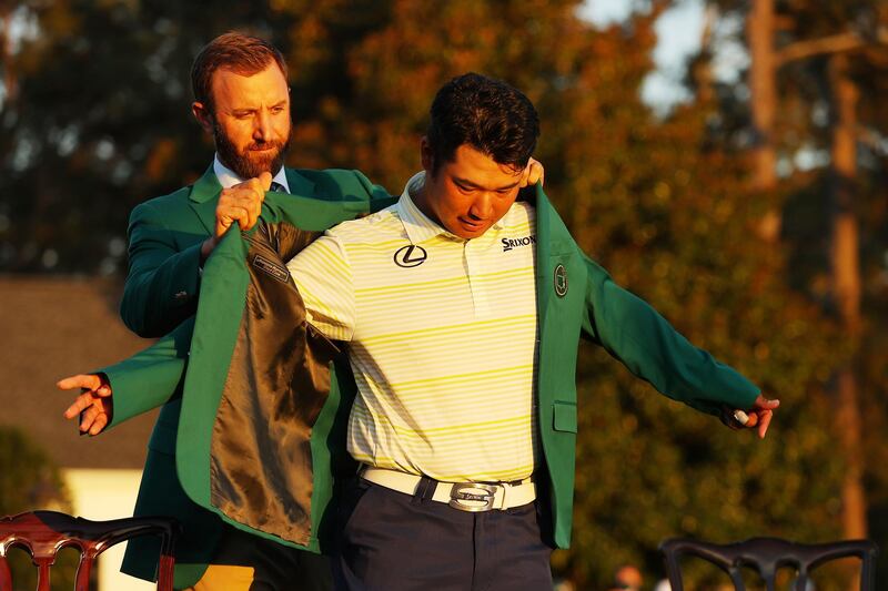 Hideki Matsuyama of Japan is awarded the Green Jacket by 2020 Masters champion Dustin Johnson of the United States during the Green Jacket Ceremony after he won the Masters at Augusta National Golf Club. AFP