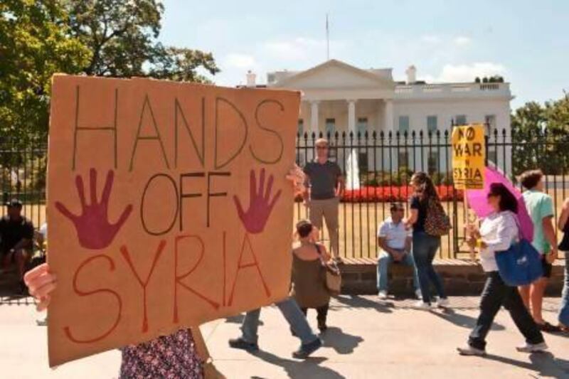 People demonstrate in front of the White House on Saturday against US intervention in Syria. Nicholas Kamm / AFP