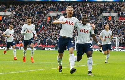 Tottenham's Harry Kane, center, celebrates after scoring his side's first goal during the English Premier League soccer match between Tottenham Hotspur and Liverpool at Wembley Stadium in London, Sunday, Oct. 22, 2017. Tottenham won by 4-1. (AP Photo/Frank Augstein)