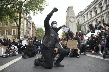 Protesters kneel on the ground during a Black Lives Matter demonstration in London last summer, a movement that led to the launch of a new commission by the UK government to investigate racial inequality. Getty