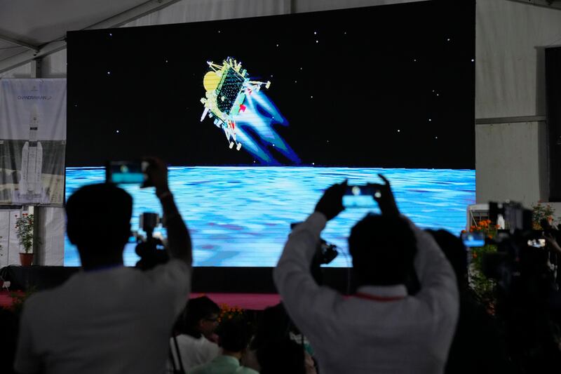 A live telecast of Chandrayaan-3 shows a digital projection of the Moon landing. AP