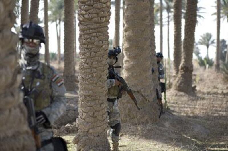 Members of Kut's Swat unit train on the outskirts of the city in the Wasit province, southern Iraq.
