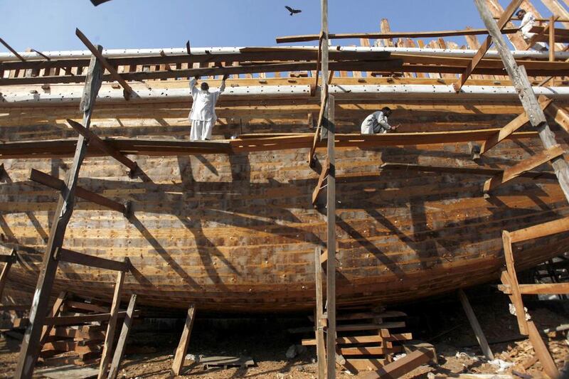 Work progresses on a boat in Karachi's Fish Harbour. Akhtar Soomro / Reuters