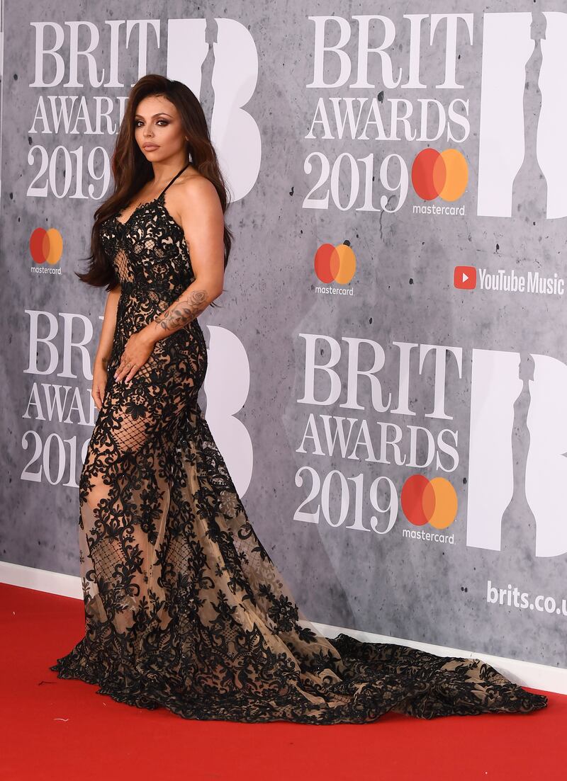 Jesy Nelson, in a black lace dress, attends The Brit Awards 2019 on February 20, 2019 in London