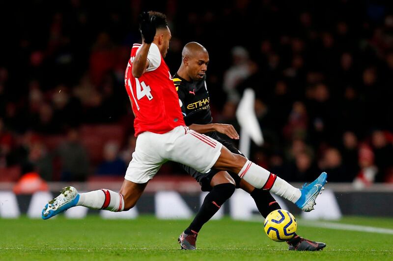 Arsenal Pierre-Emerick Aubameyang vies for the ball with Manchester City's Fernandinho in London. AFP
