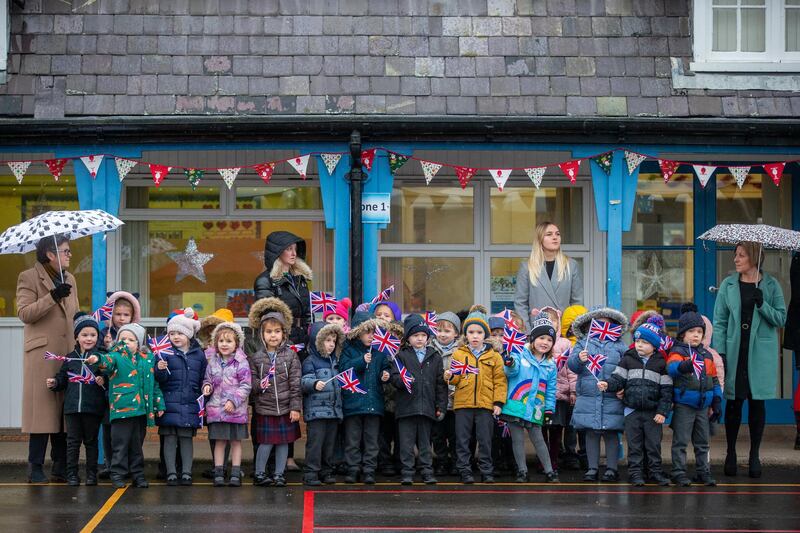 Staff and pupils from Holy Trinity Church of England First School await their arrival. Getty Images