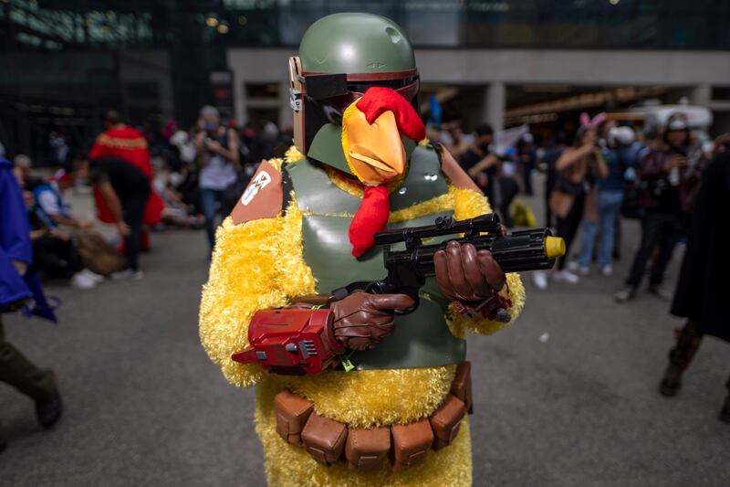 An attendee dressed as Boba Fest Chicken at New York Comic Con. Charles Sykes / Invision / AP