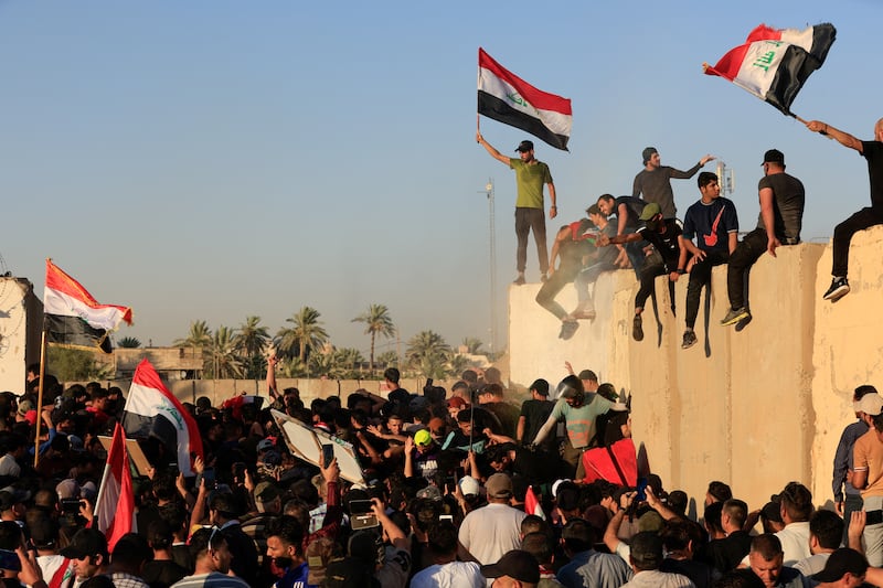 Supporters of Mr Al Sadr demonstrate in Baghdad. Reuters