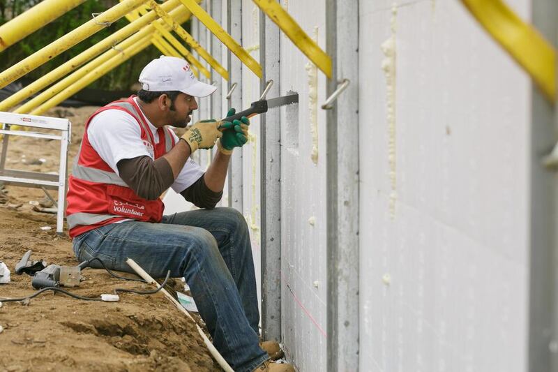 Taleb Al Blooshi works on rebuilding the home Leslie Morris on Ocean Avenue, Sea Bright, whose home was so badly damaged by Hurricane Sandy that it had to be demolished.