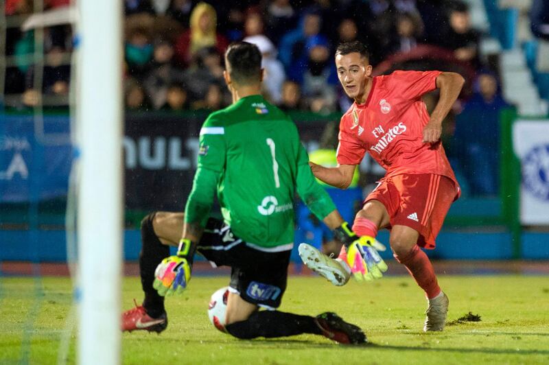 Real Madrid's Spanish midfielder Lucas Vazquez shoots in front of UD Melilla's Spanish goalkeeper Dani Barrio. AFP