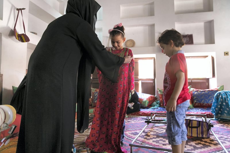 ABU DHABI, UNITED ARAB EMIRATES - JUNE 12, 2018. 

Visitors at the handicrafts workshop at Al Ain Palace Museum. Running several days a week throughout the year, a group of women teach the community Telli, Khoos, and Sadu.

Located on the western edge of Al Ain Oasis, the Palace of the late Sheikh Zayed bin Sultan Al Nahyan was built in 1937. It was converted into a museum in 1998 and opened to the public in 2001. 

(Photo by Reem Mohammed/The National)

Reporter: 
Section: WK
