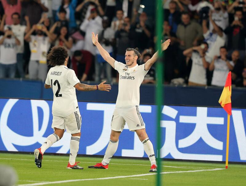 Abu Dhabi, United Arab Emirates - December 19, 2018: Gareth Bale of Real Madrid scores his third during the game between Real Madrid and Kashima Antlers in the Fifa Club World Cup semi final. Wednesday the 19th of December 2018 at the Zayed Sports City Stadium, Abu Dhabi. Chris Whiteoak / The National
