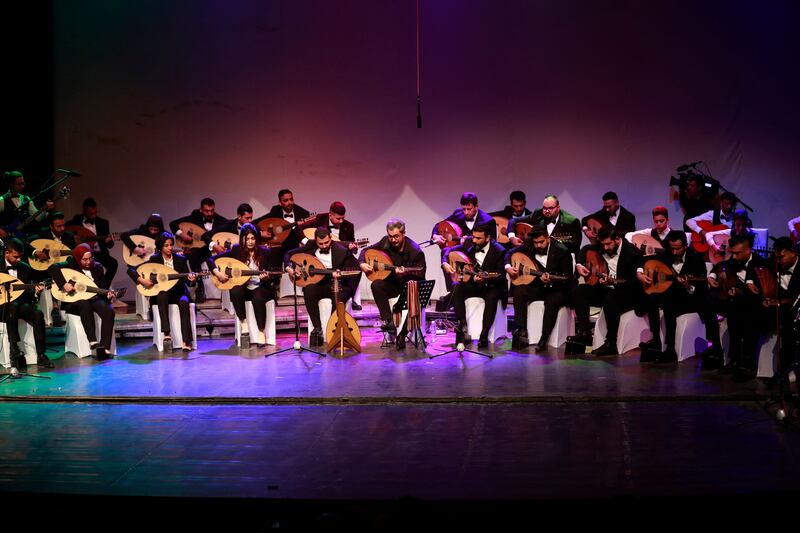 Iraqi musicians play the oud during a concert at Al Rasheed theatre in Baghdad. All photos: AFP