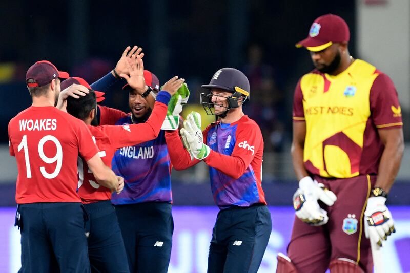 England's players celebrate after the dismissal of West Indies' Andre Russell. AFP