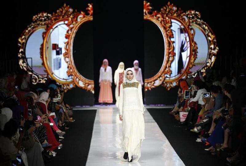 A model displays creations by Indonesian designer Merry Pramono during the Jakarta Fashion Week in Jakarta. Achmad Ibrahim / AP Photo