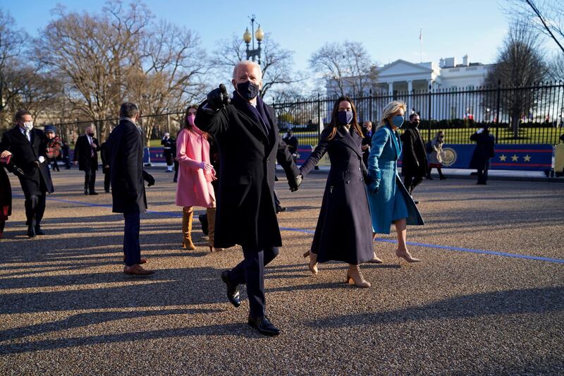 President Joe Biden, First Lady Jill Biden and family, walk in front of the White House. AP Photo