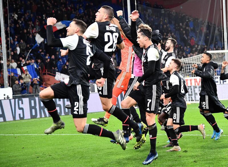 Juventus players celebrate at the whistle. EPA