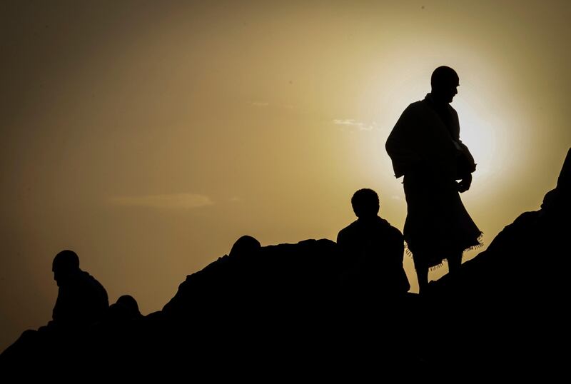 epa06173153 Muslim worshippers are silhouetted against the sunrise during the Hajj pilgrimage on the Mount Arafat, near Mecca, Saudi Arabia, 31 August 2017. Around 2.6 million Muslims are expected to attend this year's Hajj pilgrimage, which is highlighted by the Day of Arafah, one day prior to Eid al-Adha. Eid al-Adha is the holiest of the two Muslims holidays celebrated each year, it marks the yearly Muslim pilgrimage (Hajj) to visit Mecca, the holiest place in Islam. Muslims slaughter a sacrificial animal and split the meat into three parts, one for the family, one for friends and relatives, and one for the poor and needy.  EPA/MAST IRHAM