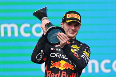 AUSTIN, TEXAS - OCTOBER 23: Race winner Max Verstappen of the Netherlands and Oracle Red Bull Racing celebrates on the podium following the F1 Grand Prix of USA at Circuit of The Americas on October 23, 2022 in Austin, Texas.    Peter Fox / Getty Images / AFP