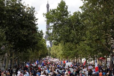 Protesters attend a demonstration called by the French nationalist party "Les Patriotes" (The Patriots) against France's restrictions, including a compulsory health pass, to fight the Covid-19 outbreak, in front of the Ministry of Health in Paris on July 31. Reuters