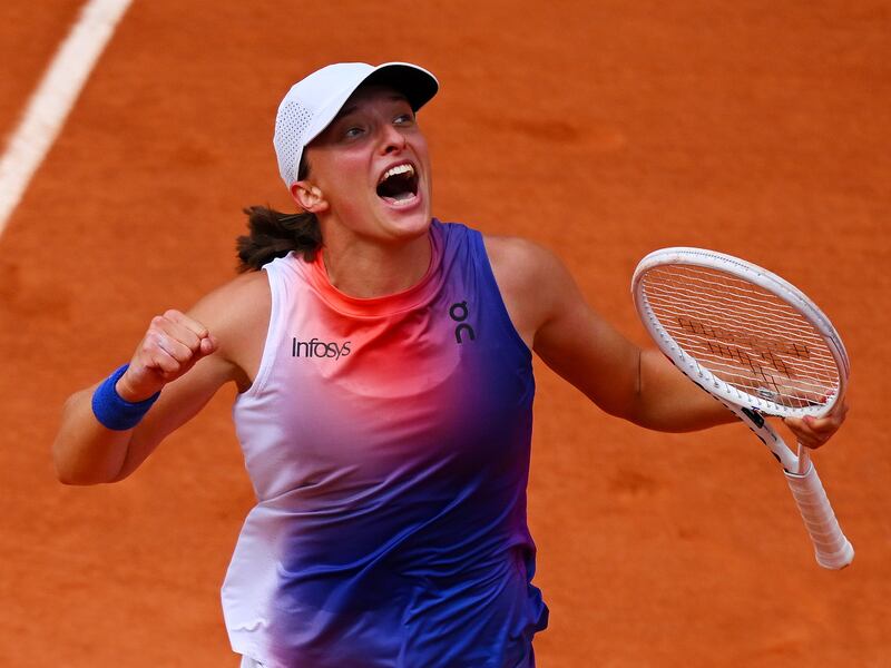 Iga Swiatek celebrates after beatting Jasmine Paolini in the French Open final match at Roland Garros on June 8, 2024. Getty Images