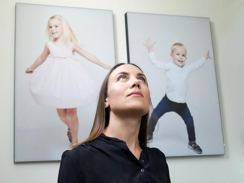 Mute founder Lotte Raun hung photographs of her children on the stairwell wall of her Arabian Ranches villa, the canvases of which absorb sound waves and turn them into micro vibrations. Photo: Mute