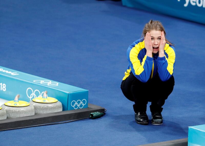 Anna Hasselborg of Sweden reacts after her team won the Curling final. Cathal Mcnaughton / Reuters