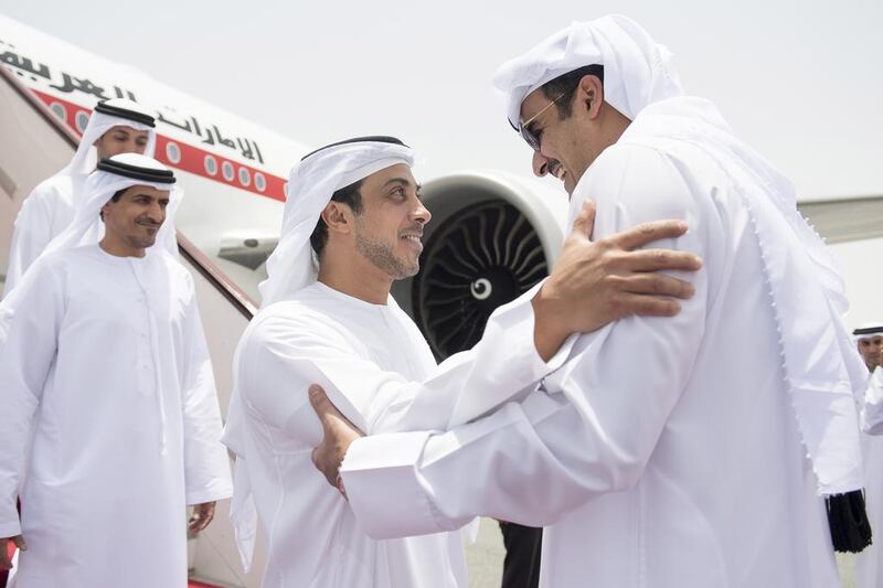 Sheikh Mansour bin Zayed is received by Sheikh Tamim bin Hamad Al Thani at Doha International Airport. With them is Ali Al Shamsi, Deputy Secretary-General of the National Security Council. Rashed Al Mansoori / Crown Prince Court - Abu Dhabi