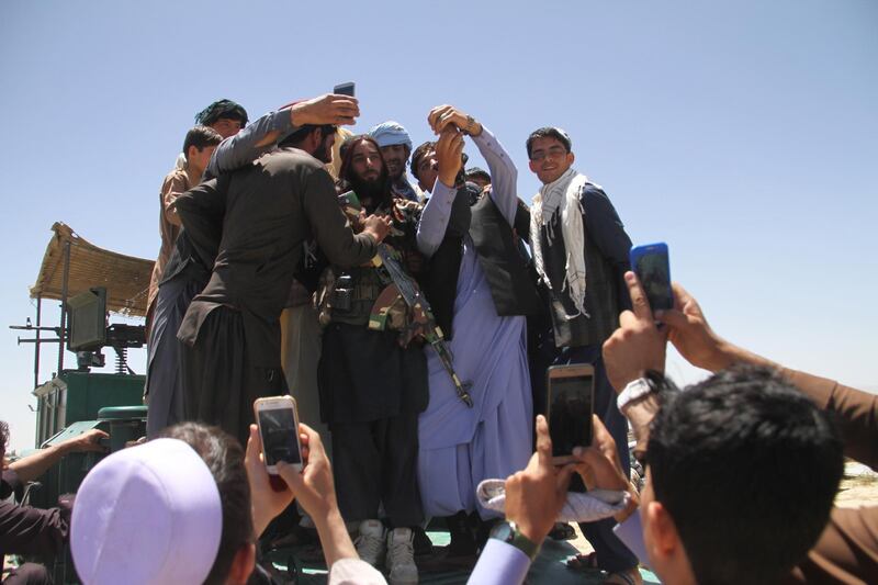 Alleged Taliban militants meets Afghan people as a group of Taliban visits to greet people as a goodwill gesture amid a three-day ceasefire on second day of Eid al-Fitr, in Ghazni, Afghanistan, on June 16, 2018. STR / EPA