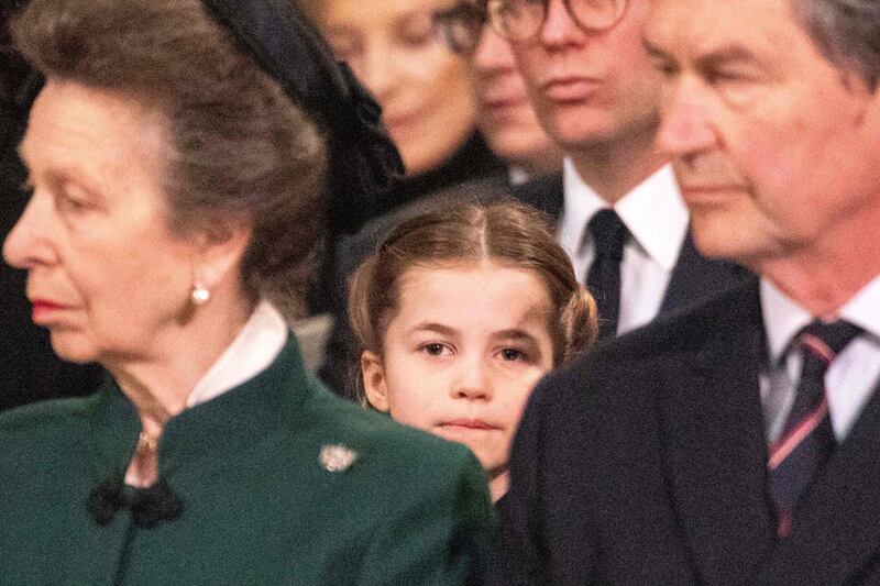 Princess Charlotte sits behind Princess Royal, Anne, and Vice Admiral Timothy Laurence during a Service of Thanksgiving for Britain's Prince Philip, at Westminster Abbey in March 2022. AFP