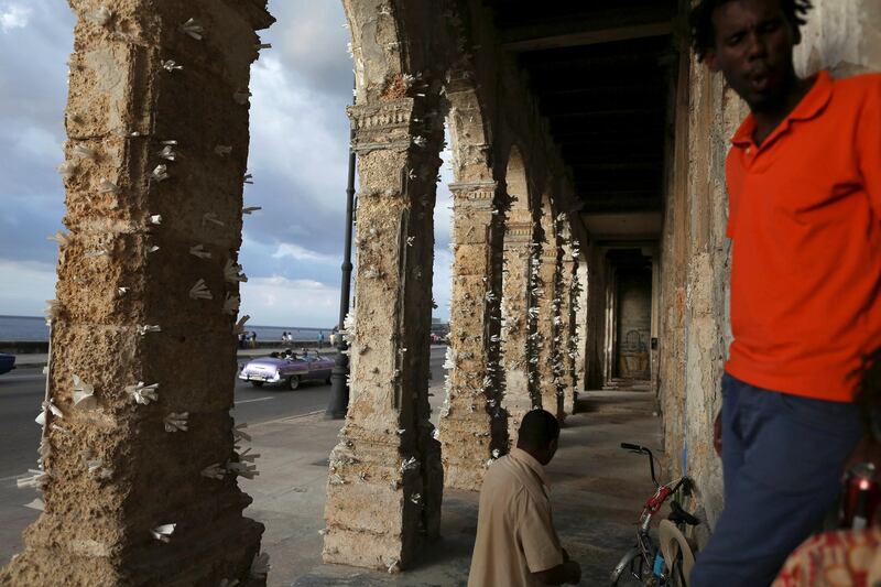 People stand near Fonseca's work. REUTERS