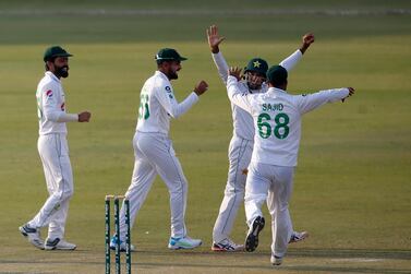 Pakistan's Abid Ali, second right, celebrates with teammates after taking the catch of South Africa's Rassie van der Dussen during the third day of the first cricket test match between Pakistan and South Africa at the National Stadium, in Karachi, Pakistan, Thursday, Jan. 28, 2021. (AP Photo/Anjum Naveed)