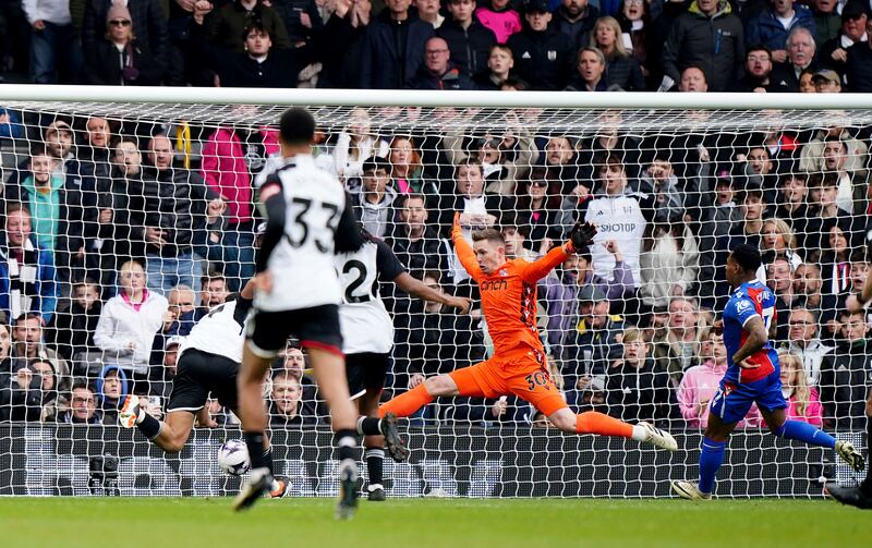 Fulham's Rodrigo Muniz, left, scores the opening goal against Crystal Palace. AP
