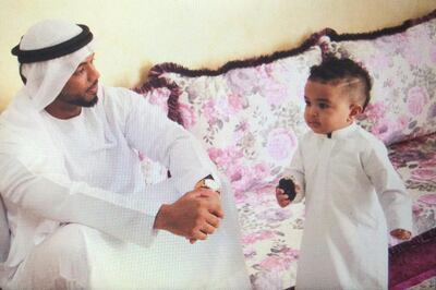 Sergeant Ali Al Mesmari with his son Khalifa . Courtesy of Amira Al Mesmari (cousin)