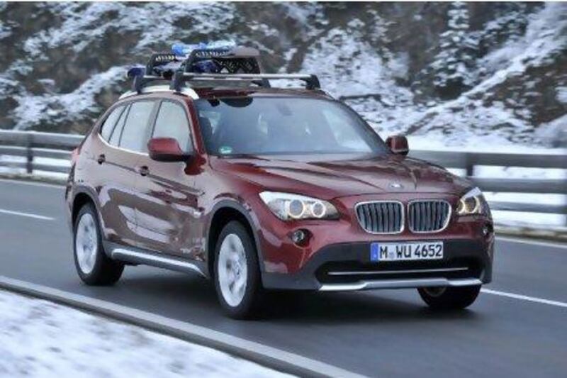 The X1's four-cylinder engine sounds rough but packs a punch. Courtesy of BMW