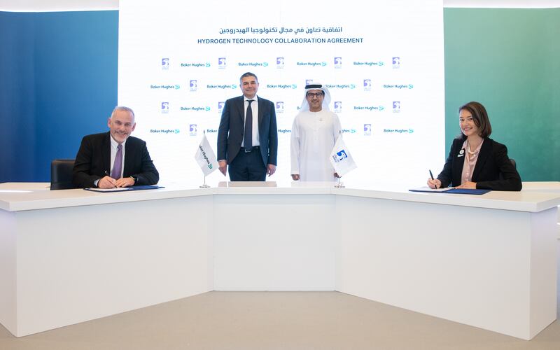 Baker Hughes’s chief technology officer Chris Barkey and his Adnoc counterpart Sophie Hildebrand sign the agreement at the Climate Tech Conference in Abu Dhabi. Looking on are Lorenzo Simonelli, chairman and chief executive of Baker Hughes, and Musabbeh Al Kaabi, Adnoc executive director for low carbon solutions and international growth directorate. Photo: Adnoc