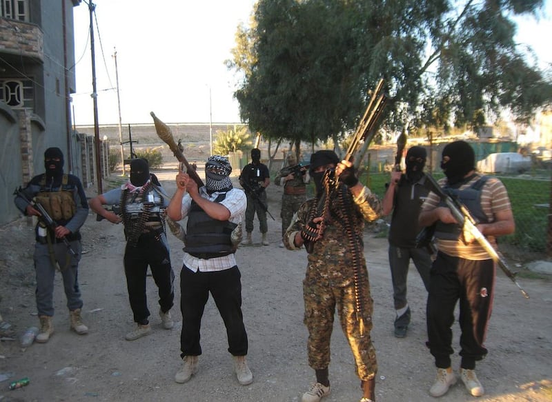 Masked anti-government gunmen patrol in Fallujah, in the western Iraqi province of Anbar. AP Photo / March 15, 2014