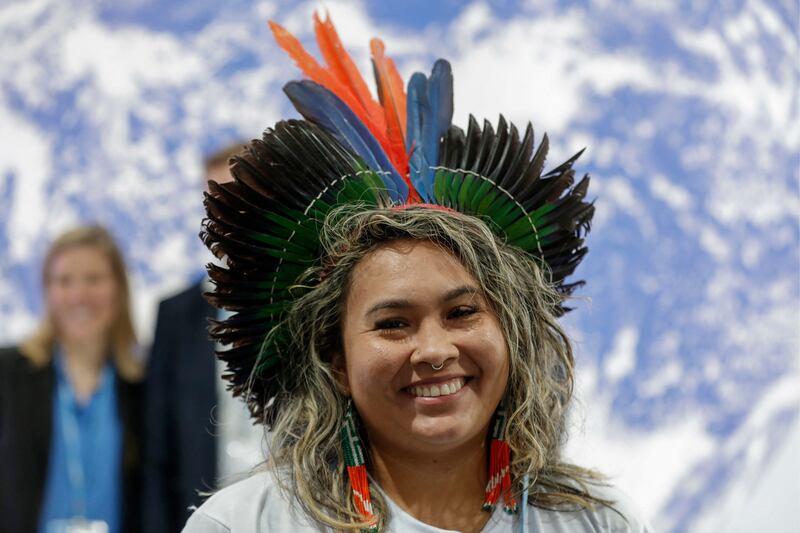 A delegate poses for a picture during Cop27 at the Sharm El Sheikh International Convention Centre. AFP