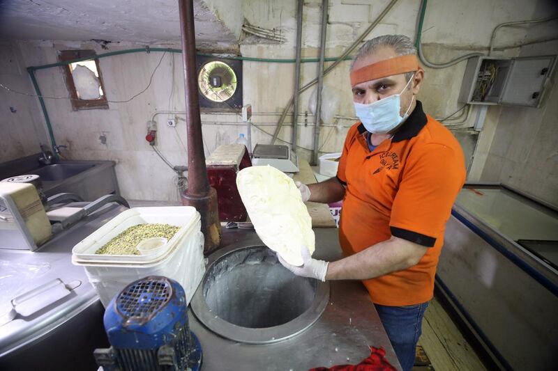 Syrian Migrant Yasser, aka Abo Aly, who feld from the armed conflict in Syria, works at an ice cream workshop in Cairo, Egypt. Yasser came to Egypt in 2012 to escape the armed conflict in Syria, and he used to work in this field for 25 years at the Hamidiyeh market in Damascus. World Refugee Day is marked on 20 June each year to highlight the suffering of the tens of millions of people forced to flee their homes due to war or persecution.  EPA