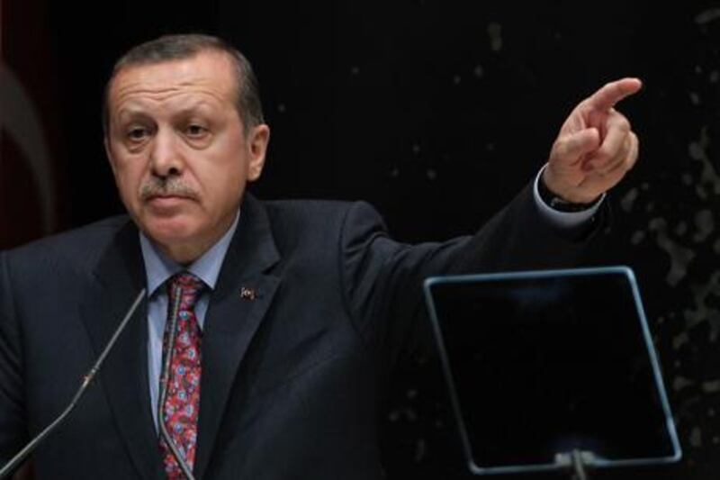 Turkish Prime Minister Recep Tayyip Erdogan defends the legislation passed that restricts the sale of alcohol. AP Photo