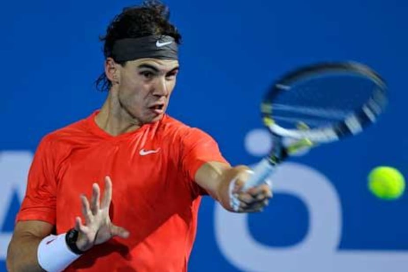 Rafael Nadal from Spain returns the ball to Roger Federer of Switzerland during the final match.