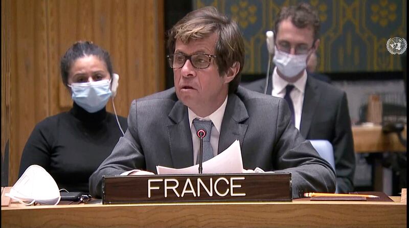 France's ambassador Nicolas de Riviere follows proceedings. AP