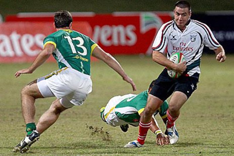 Quihen Marais, right, the UAE fly-half, scored the hosts only points as they were beaten heavily by Brazil last night.