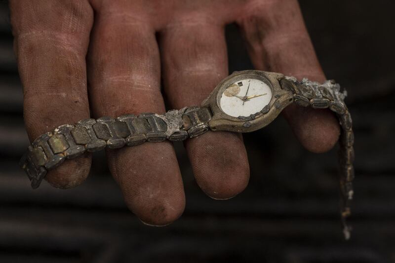 Don Bedford holds wristwatch he salvaged from his girlfriends burnt home in a mobile home park in Ashland, Oregon. Hundreds of homes in Ashland and nearby towns have been lost due to wildfire. AFP