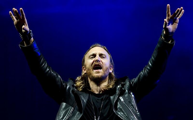 FILE - This Sept. 13, 2013 file photo shows French recording artist David Guetta performing at the opening night of the 5th annual Rock in Rio music festival, in Rio de Janeiro, Brazil. Guetta will project a full-length music video for his new track “One Voice” onto the exterior of the United Nations Secretariat Building, Friday, Nov. 22, to launch  “The World Needs More" campaign.   (AP Photo/Felipe Dana, File)