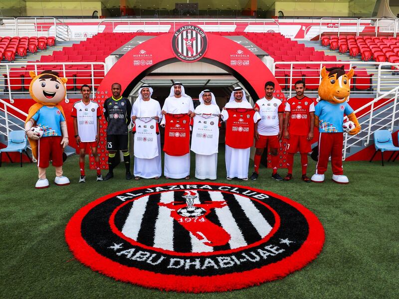 Abu Dhabi, U.A.E., August 29, 2018. 
As part of Mubadala’s sponsorship to the Special Olympics World Games 2019, Presentation of Jersey - - -   (L-R) Ahmed Al Gilani (special olympian); Ali Mabkhout Al Hajeri, forward; Dr. Yousef Al Hammadi, Chief Intelligence Officer Special Olympics; Homaid Al Shimmari, Deputy Group CEO Mubadala; H.E. Mohammed Saif Al Suwaidi, Chairman of Al Jazira Football Sport Company; Talal Al Hashemi, National Director, Special Olympics UAE; Abdul Rahman Al Gilani-28, special olympian and Ali Kaseif Al Hosani, Goalkeeper.
Victor Besa / The National
Section:  NA
Reporter:  Haneen Dajani